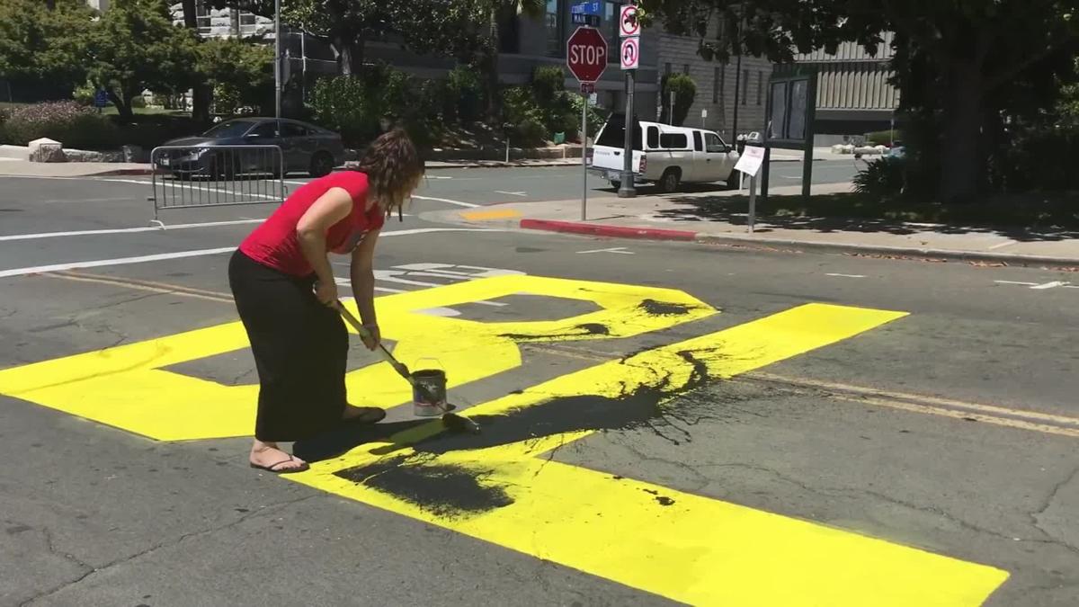 Two people are charged with a hate crime for vandalizing a Black Lives Matter mural