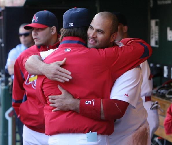 St. Louis Cardinals Lance Berkman embraces Albert Pujols after the