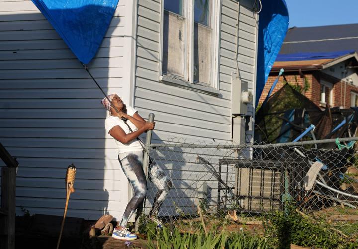 Tornado leaves residents reluctant to separate from damaged property