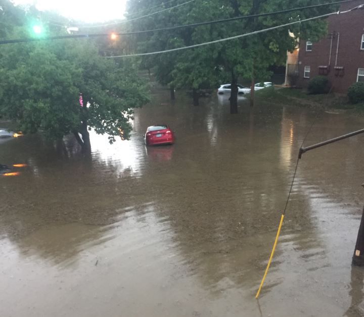 Flooding in Maplewood swamps cars on Laclede Station Road Metro