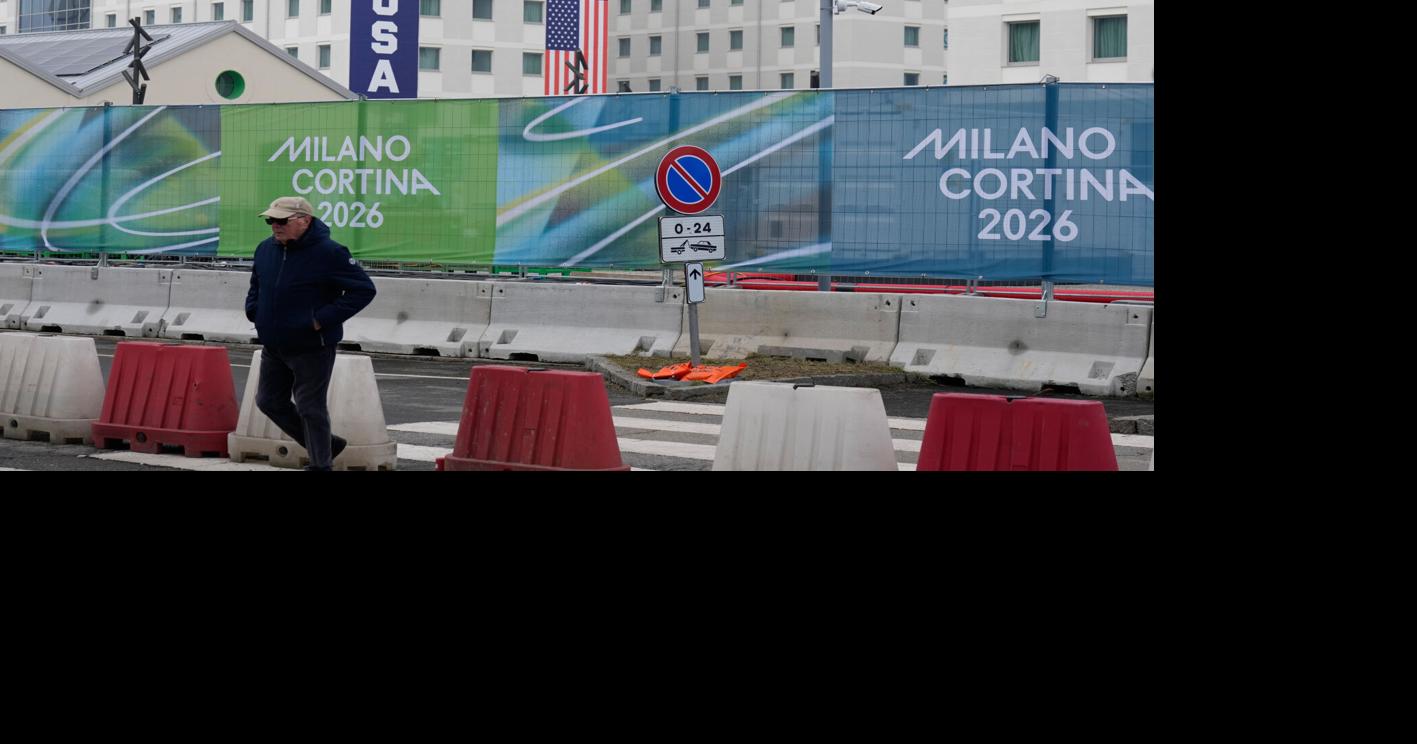 Athletes bring Milan Olympic Village to life, complete with Italian bidets and 4-story US banners