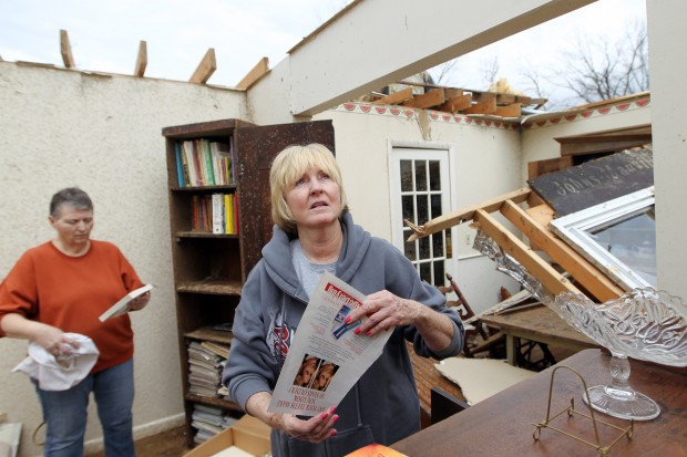 Harrisburg Tornado Aftermath- Miki Pavelonis wraps up collectibles and paper