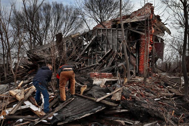 Cutting metal pipe at a collapsed NorthSide property