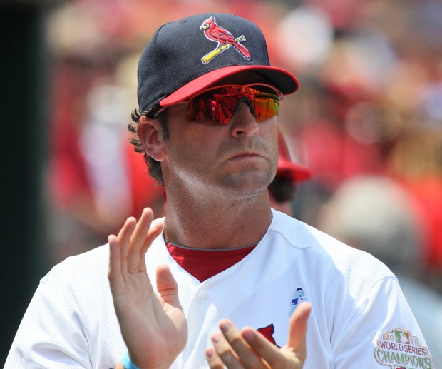 St. Louis Cardinals manager Mike Matheny and Mark McGwire watch