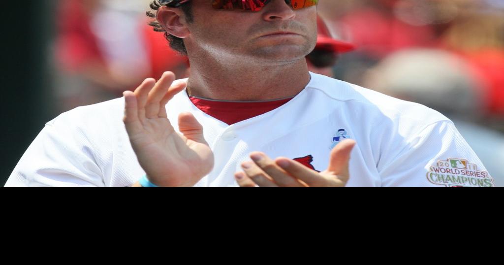 St. Louis Cardinals manager Mike Matheny and Mark McGwire watch