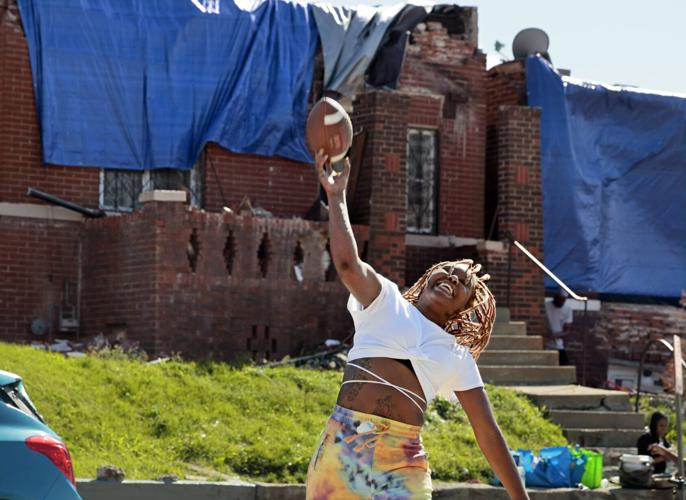 Tornado leaves residents reluctant to separate from damaged property