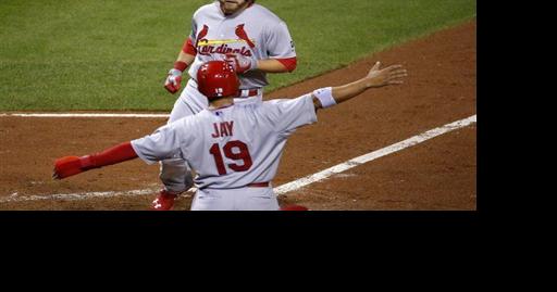 Jon Jay of the St. Louis Cardinals, left, celebrates with teammate