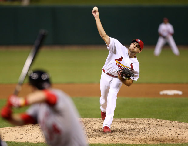 St. Louis Cardinals pitcher Michael Wacha can't make a play on a ball hit  by Washington Nationals Ryan Zimmerman in the ninth inning at Busch Stadium  in St. Louis on September 24