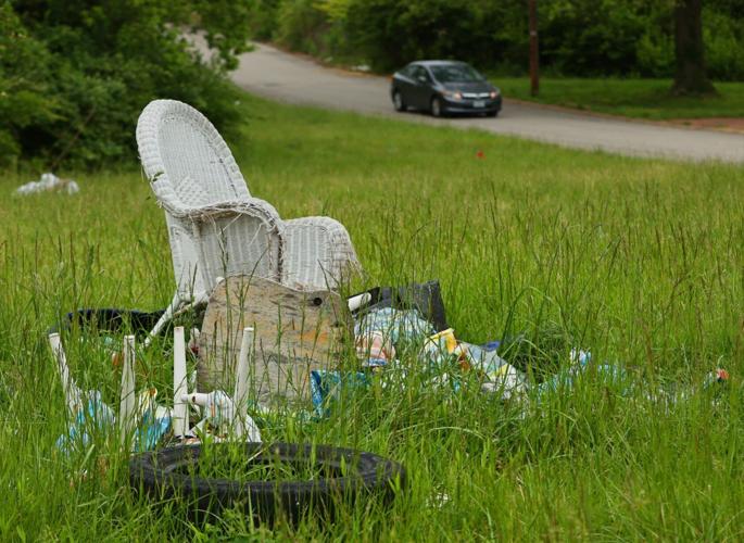 Across Kinloch, illegal dumping leaves trash in roadways and overgrown
