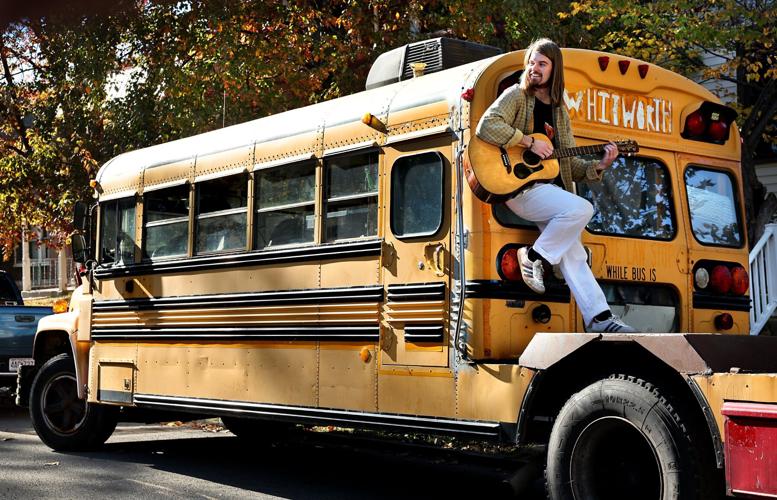 Musician tours country in a school bus with a stage