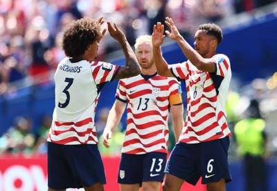 June 19, 2026; Seattle, Washington, U.S.; Chris Richards, Auston Trusty and Tim Ream of the U.S. celebrate after the match. Mandatory Credit: Blake Dahlin-Imagn Images