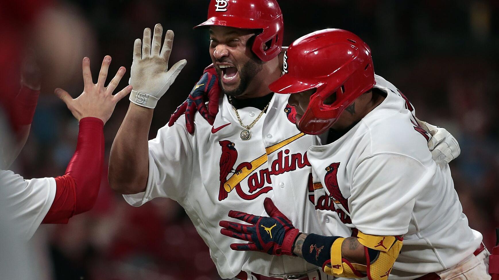 Pujols rescues Cardinals in 10th for 3-2 win as Goldschmidt, Wainwright shine