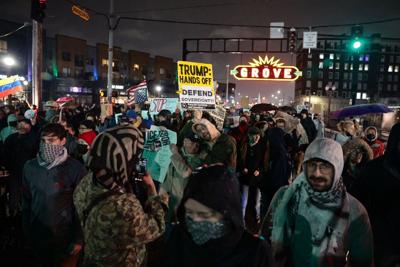 �����Ӱ�ԭ��ans protest Minnesota ICE killing, in pouring rain