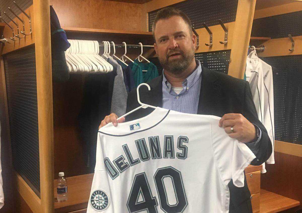 Brian DeLunas holds his Mariners jersey