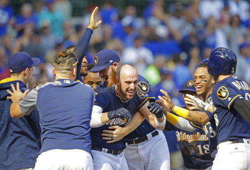 The Latest: Brewers win NL Central title, Cubs get wild card