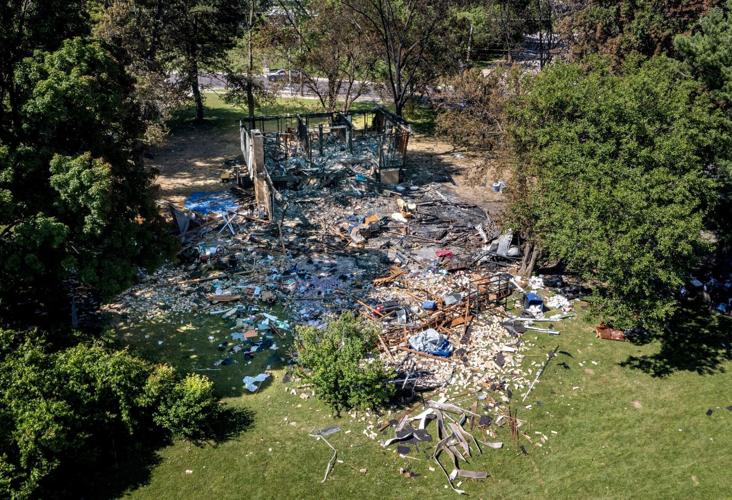 Two men charged with murder in home explosion