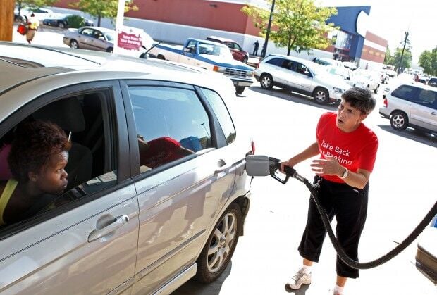 Woman pumps gas in Hazelwood