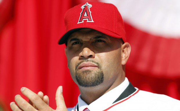 From left to right, Los Angeles Angels owner Arte Moreno, son of Albert  Pujols, Alberto Pujols Jr., owner Carole Moreno, wife of Albert Pujols, Deidre  Pujols, Albert Pujols, C.J. Wilson, general manager