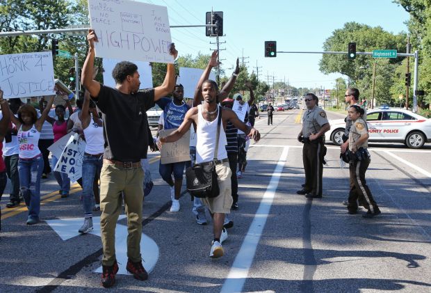 Ministers try peaceful protest through Ferguson