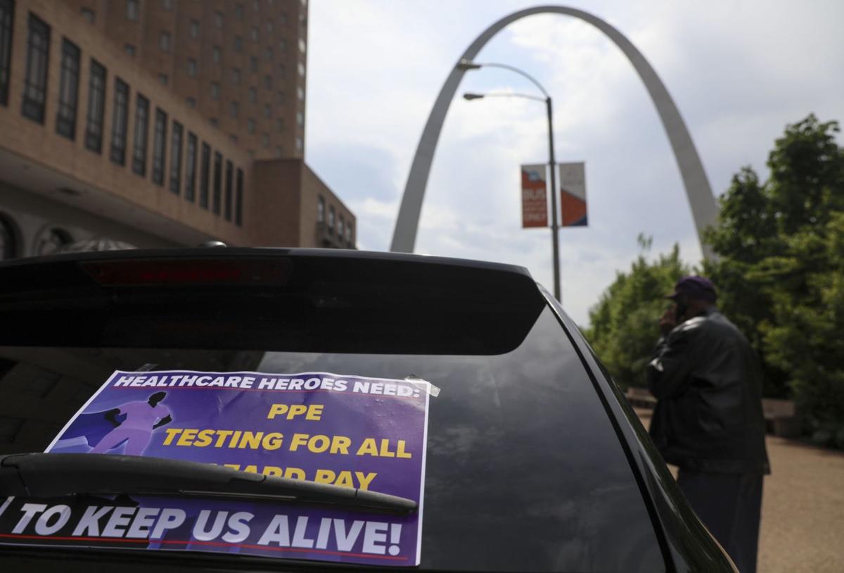 Essential workers caravan parades through downtown
