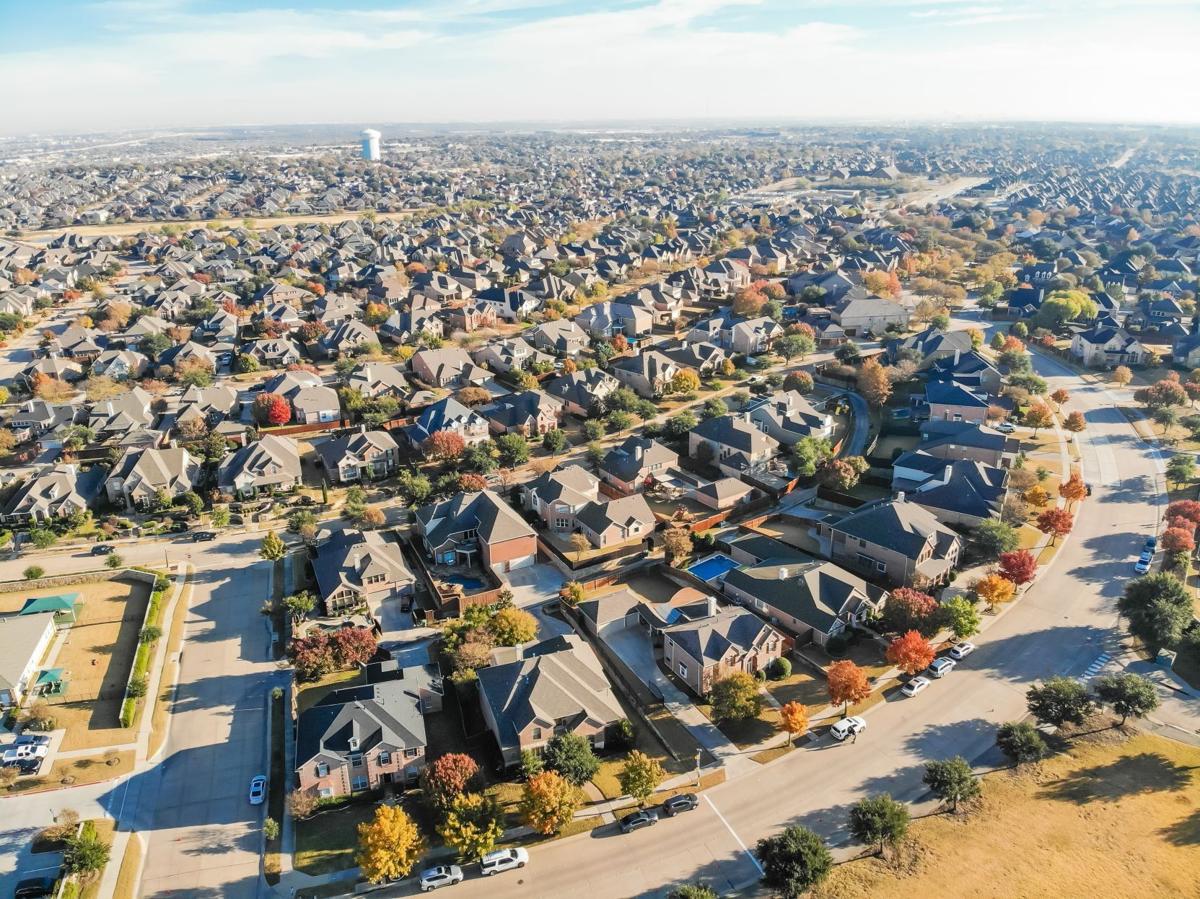 Top view row of single family houses in residential area with fall foliage