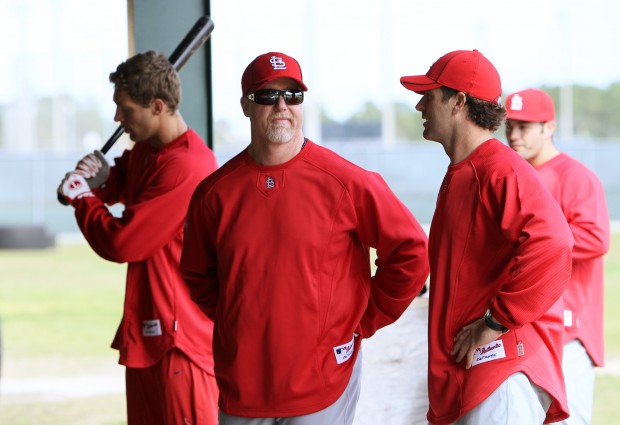 St. Louis Cardinals manager Mike Matheny and Mark McGwire watch