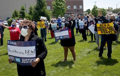 Alicia Hernandez wears her heart glasses at rally for Medicaid Expansion
