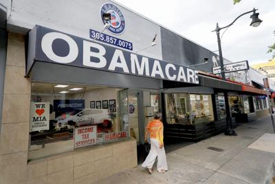 An Obamacare sign is displayed outside an insurance agency on Nov. 12, 2025, in Miami.