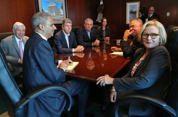 Holder visits with students, community leaders, Michael Brown's family ...