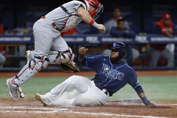 Yadier Molina pitches shutout inning in 11-3 loss to Rays