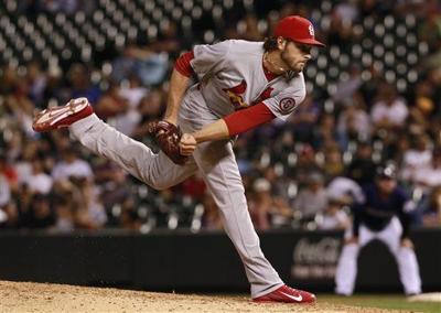 Holliday leads Cards to 11-4 win over Rockies