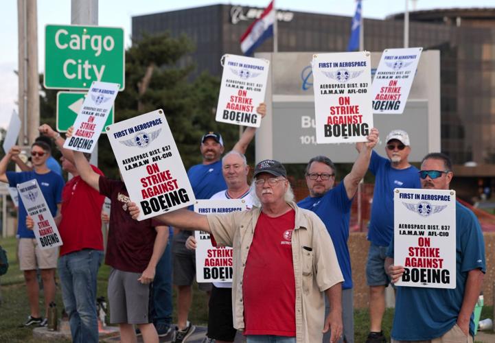 Boeing workers, vote down contract, begin strike