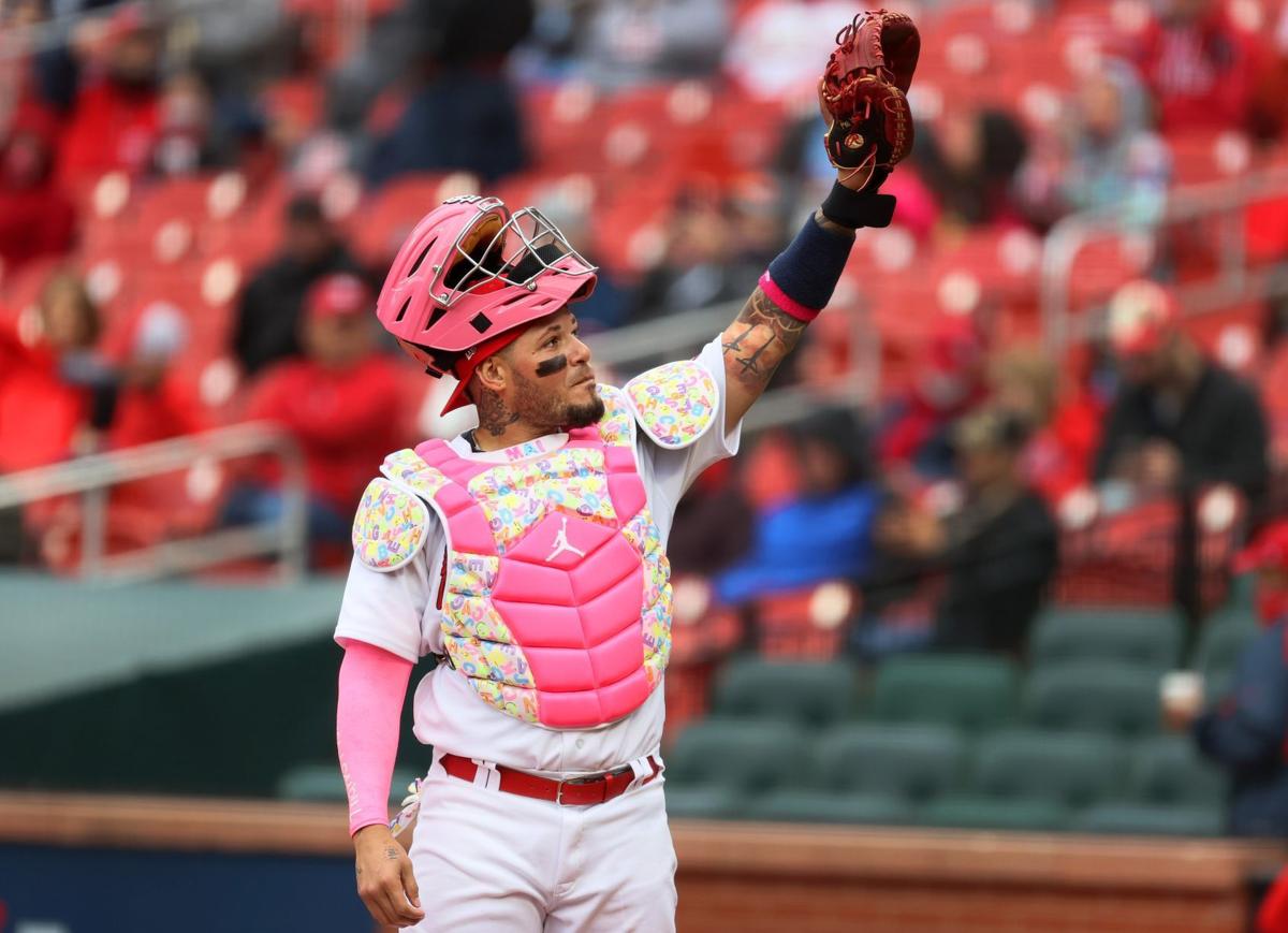 ST. LOUIS, MO - MAY 09: St. Louis Cardinals catcher Yadier Molina (4) wears pink  gear in honor of Mother's Day during a game featuring the Colorado Rockies  at the St. Louis