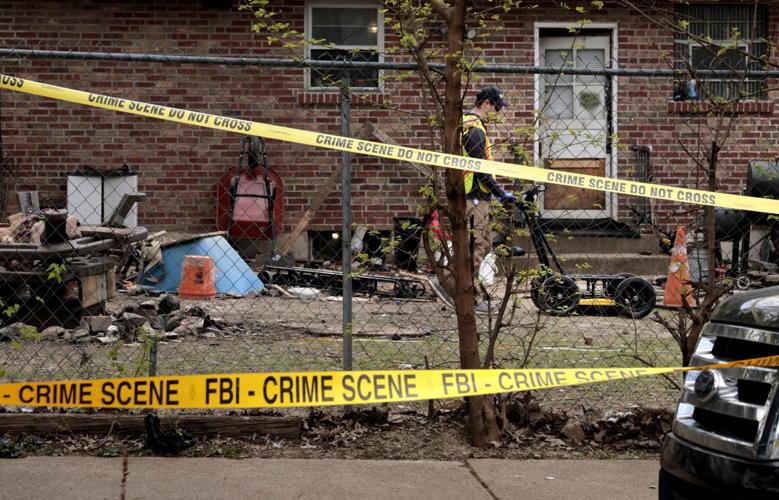 FBI crew digs in the yard at a home in Dutchtown