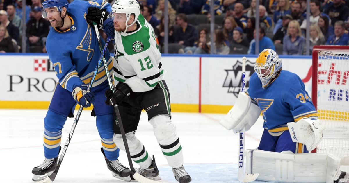 St. Louis Blues' Alex Pietrangelo (27) and Alexander Steen (20) celebrate  with goaltender Jordan Binnington after their 3-2 win against the Dallas  Stars during Game 1 of an NHL second-round hockey playoff
