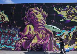 Paint St. Louis puts new art on an old downtown St. Louis wall