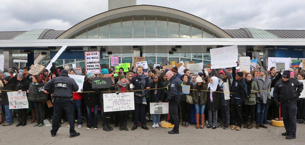 Protesters converge on Lambert over Trump policies