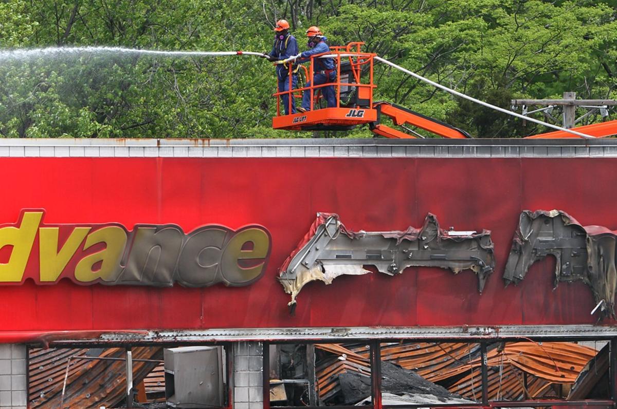 Demolition of burned buildings continues in Ferguson