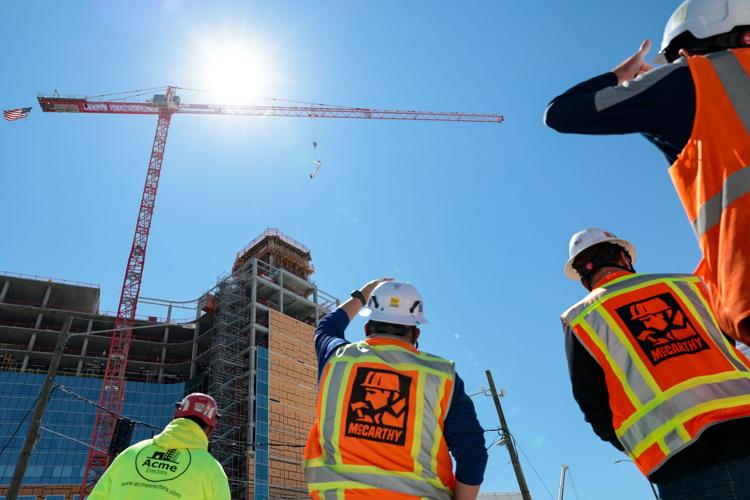 SMM Health holds a ‘topping off’ ceremony with signed beam on new pediatric 14-story hospital