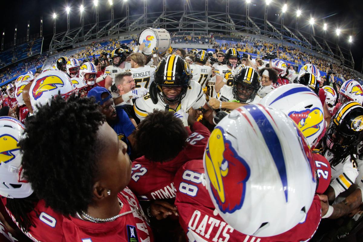 Missouri Tigers and Kansas Jayhawks players get into a tussle following the game inside David Booth Kansas Memorial Stadium on