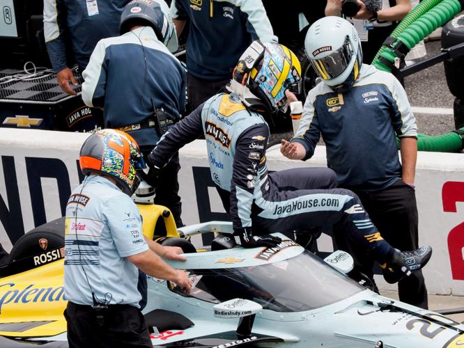 Ed Carpenter Racing driver Alexander Rossi (20) is helped out of his car Friday, May 22, 2026, during Carb Day ahead of the