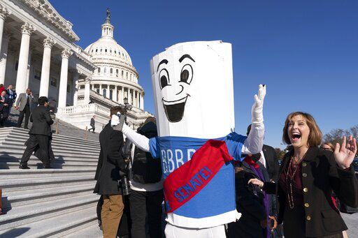 House OKs $2T social, climate bill in Biden win; Senate next