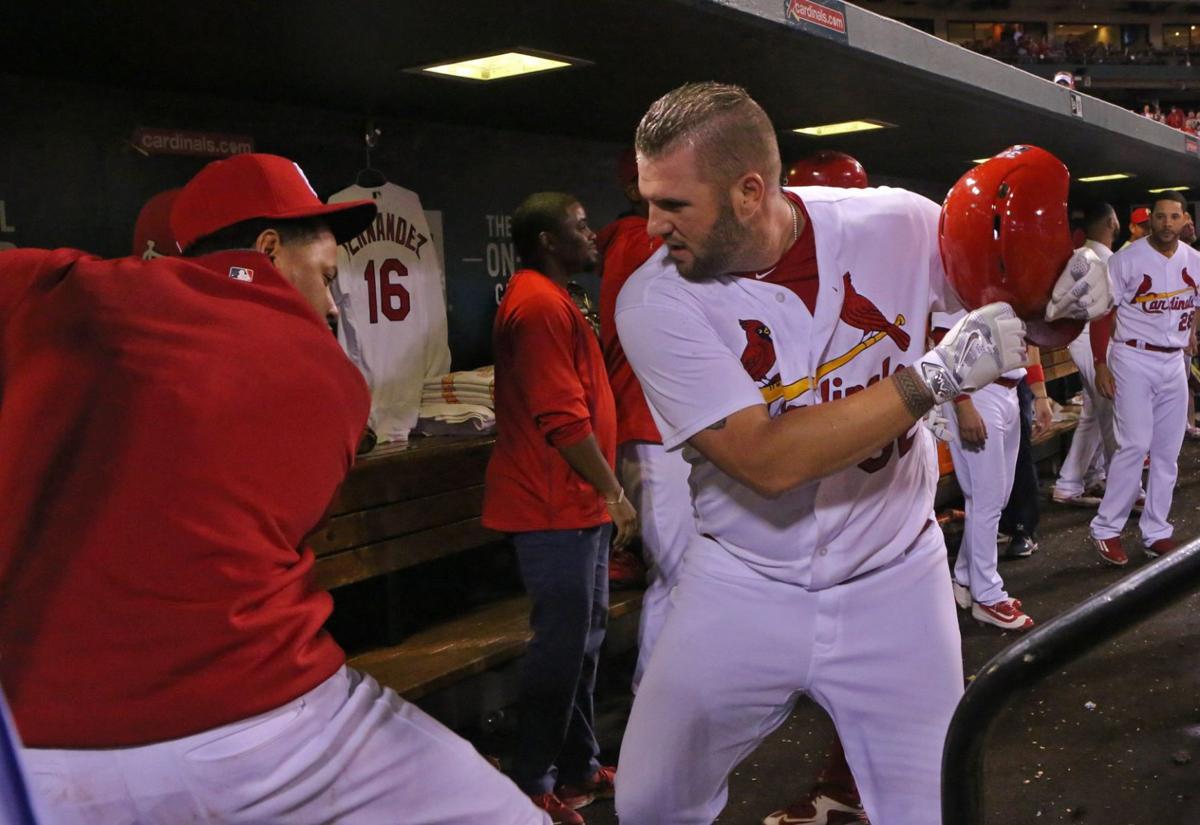 Jon Jay of the St. Louis Cardinals, left, celebrates with teammate