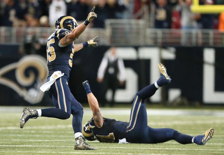 St. Louis Rams defensive tackle Aaron Donald, left, celebrates