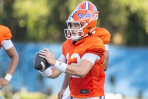 Florida 2026-2027 quarterback Aaron Philo (12) throws during Florida football practice at Heavener Football Complex in