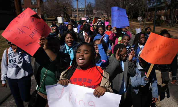 Normandy seventh-graders march in support of their district