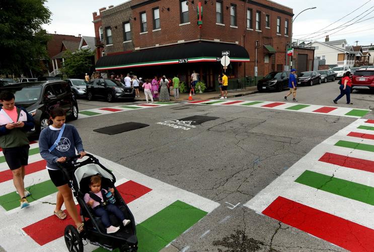 Residents enjoying  newly painted red, white and green crosswalks on The Hill