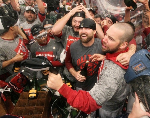 St. Louis Cardinals Lance Berkman embraces Albert Pujols after the  Cardinals won the 2011 World Series in St. Louis on October 28, 2011. The  Cardinals defeated the Texas Rangers 6-2 winning game