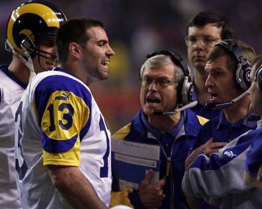 Former St. Louis Rams Isaac Bruce holds the Super Bowl trophy during  ceremonies celebrating the teams Super Bowl victory in the 1999-2000  season, at the Edward Jones Dome during half time of