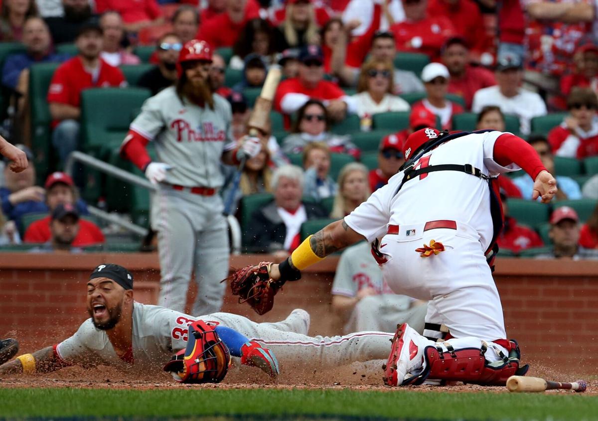Philadelphia Phillies' Jean Segura is hit by a pitch during the fifth  inning in Game 2 of a National League wild-card baseball playoff series  against the St. Louis Cardinals, Saturday, Oct. 8